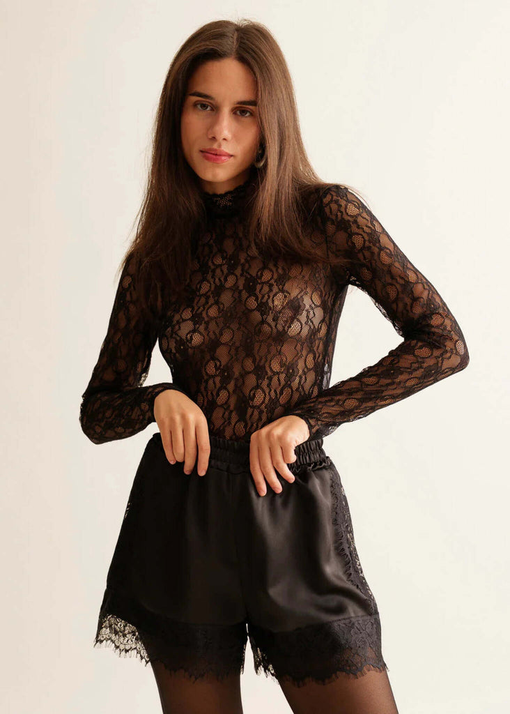 Marcia Shorts — Black satin shorts with lace trim, on model — MYFASHIONFRUIT