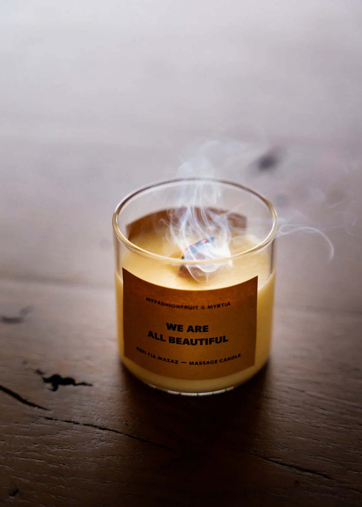 Massage Candle — lit candle in glass with smoke — MYFASHIONFRUIT