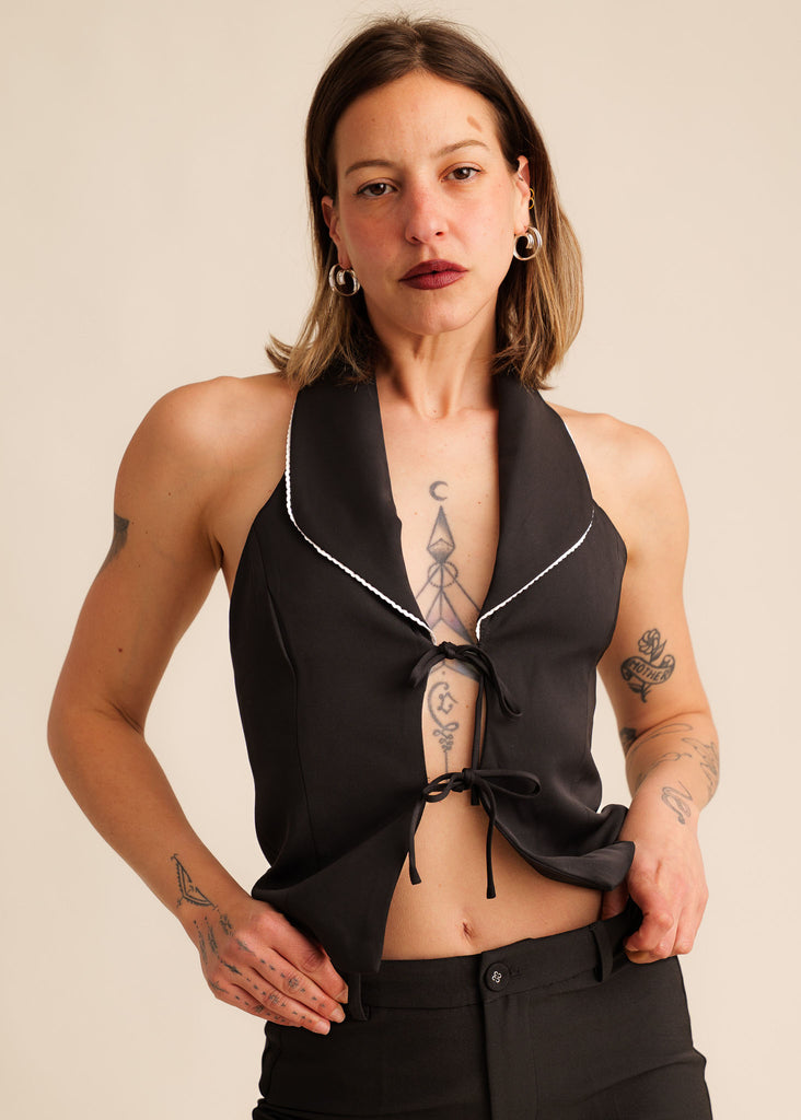 Cassiopée Waistcoat Top — Black halter neck top with white trim, on model — MYFASHIONFRUIT