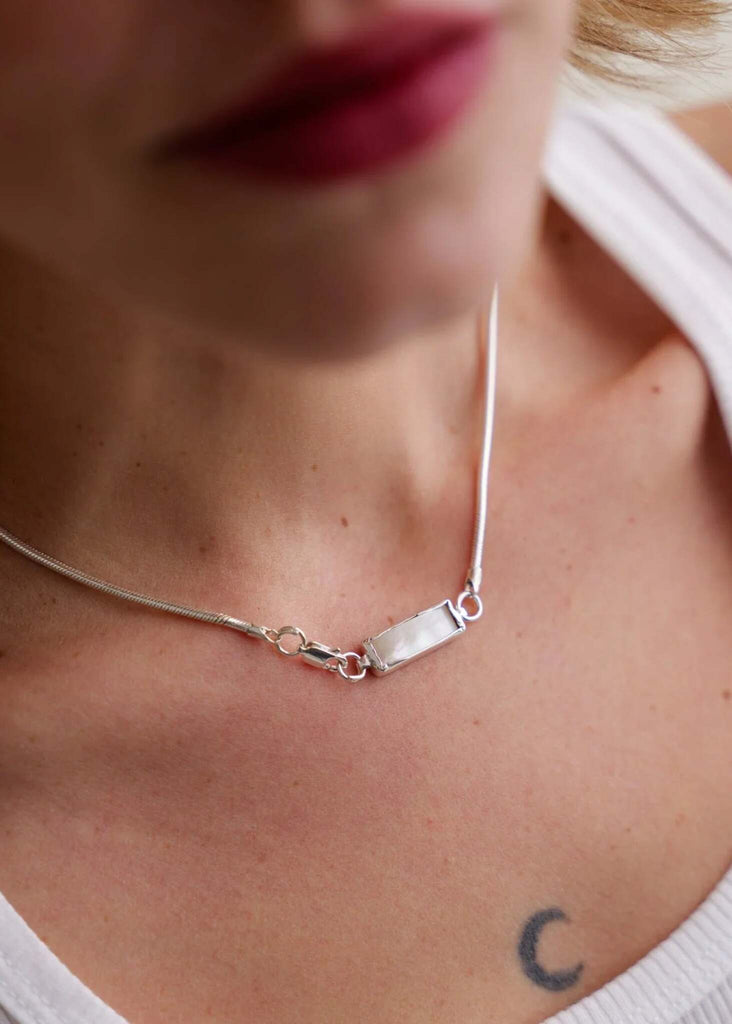 Eurydice Necklace — Silver chain with white pendant on model — MYFASHIONFRUIT