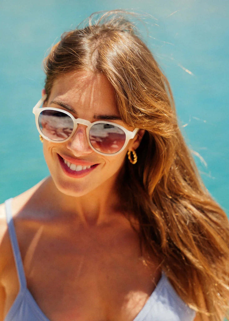 Komono LIAM Daffodil Sunglasses — sunglasses with white frames on model — MYFASHIONFRUIT