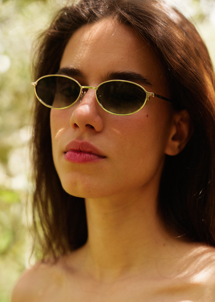 Komono TYLA Sunglasses — model wearing oval gold sunglasses — MYFASHIONFRUIT
