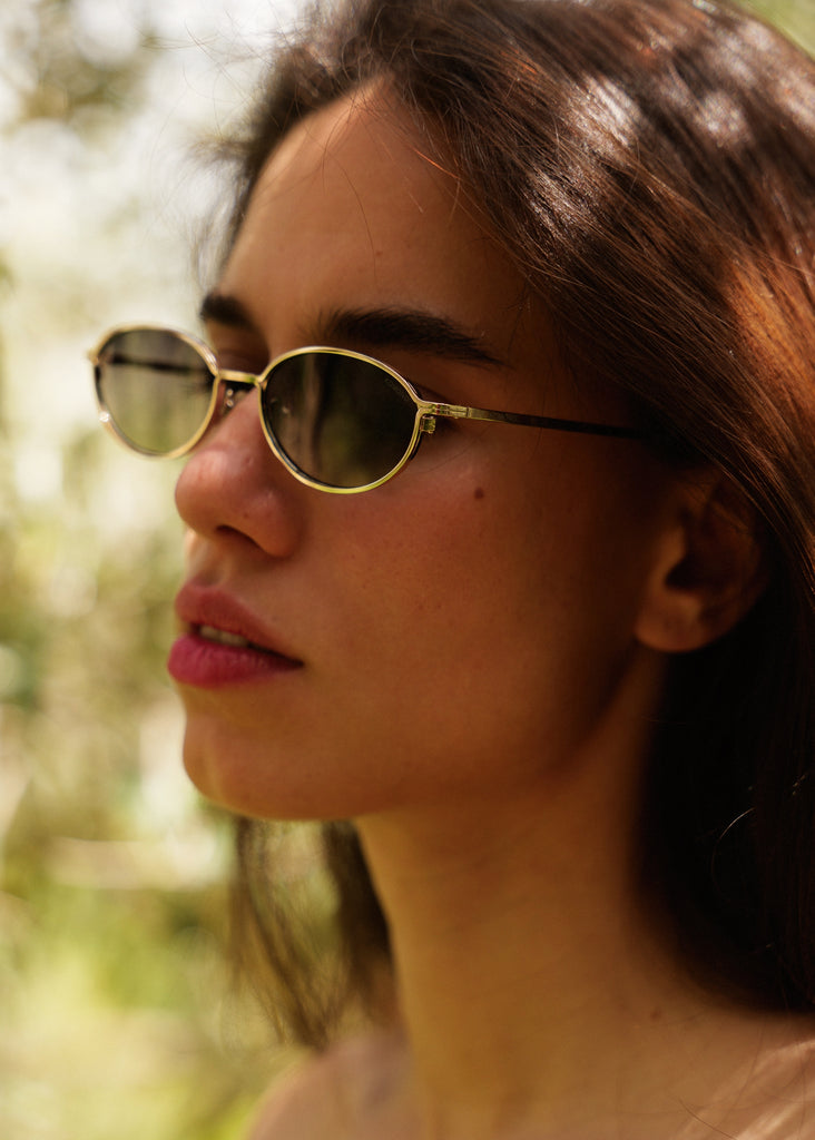 Komono TYLA Sunglasses — model wearing gold sunglasses — MYFASHIONFRUIT