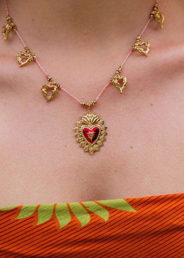 Rousseau Necklace — Gold heart pendant on pink cord on model — MYFASHIONFRUIT
