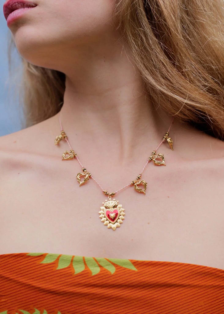 Rousseau Necklace — Pink cord necklace with gold charms on model — MYFASHIONFRUIT
