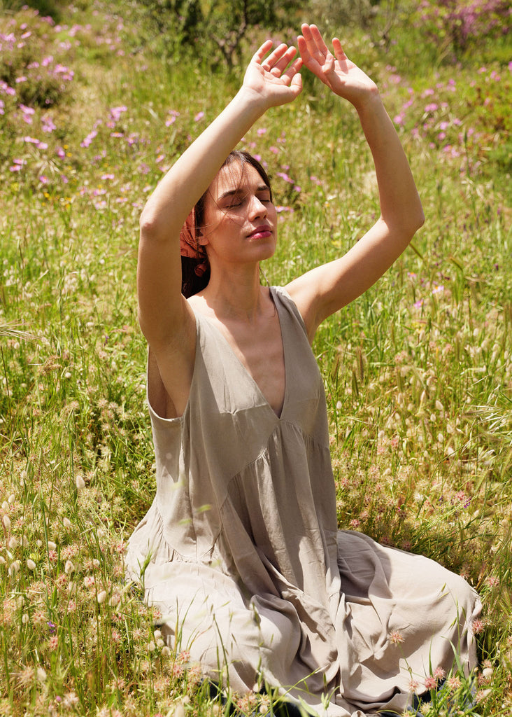 Gaea Dress — Beige v-neck dress on model in field — MYFASHIONFRUIT