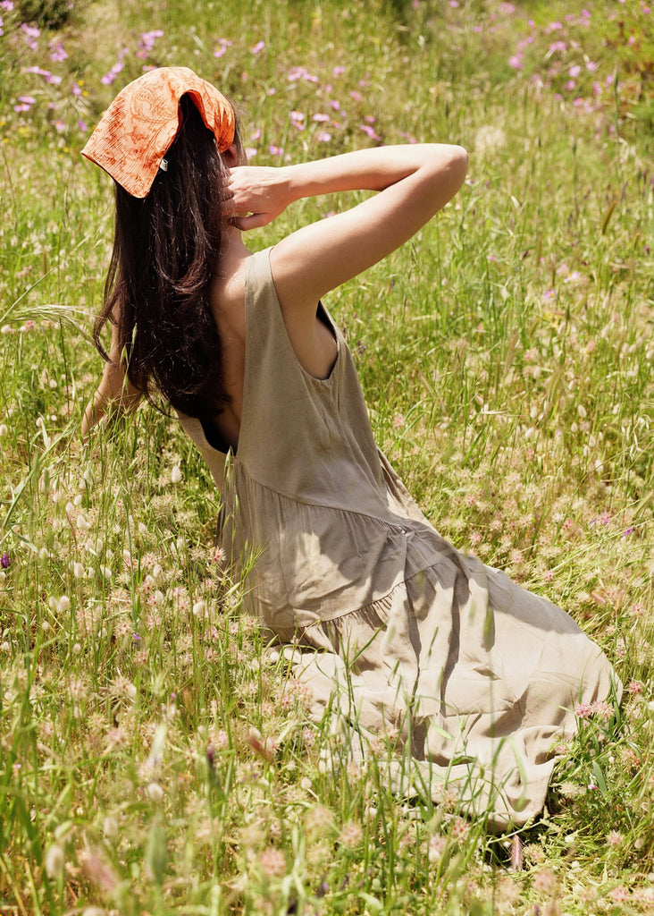 Gaea Dress — Beige dress on model in field — MYFASHIONFRUIT