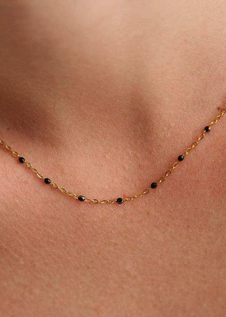 Dakota Necklace — Gold chain necklace with black beads on model — MYFASHIONFRUIT