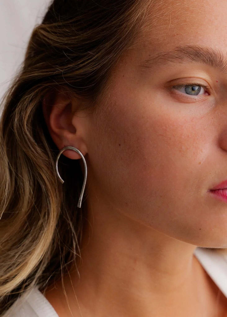 Spicy Silver Earrings — silver horseshoe shape on model — MYFASHIONFRUIT