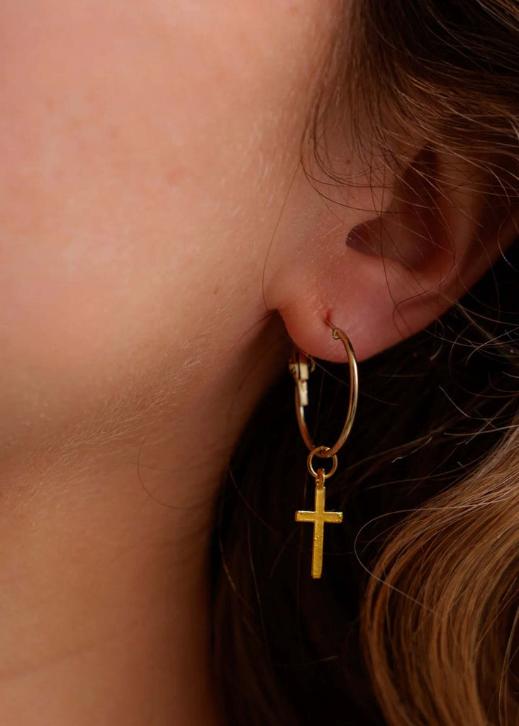 No Cross No Crown Earrings — gold hoop with cross detail on model — MYFASHIONFRUIT