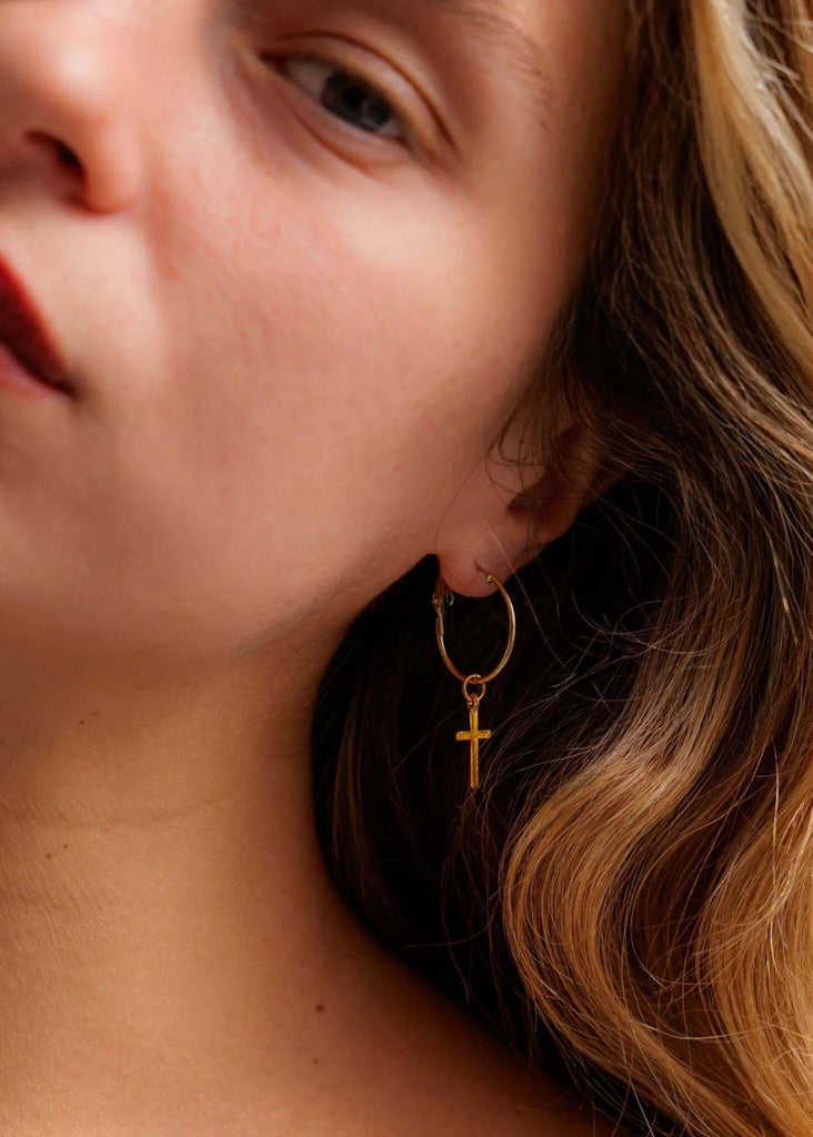 No Cross No Crown Earrings — Gold cross hoop on model — MYFASHIONFRUIT