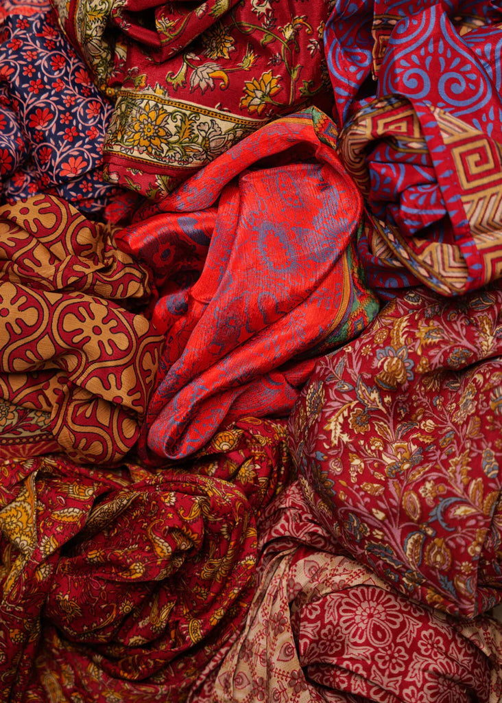 Bijal Silk Scarf - Reds — pile of patterned red silk — MYFASHIONFRUIT
