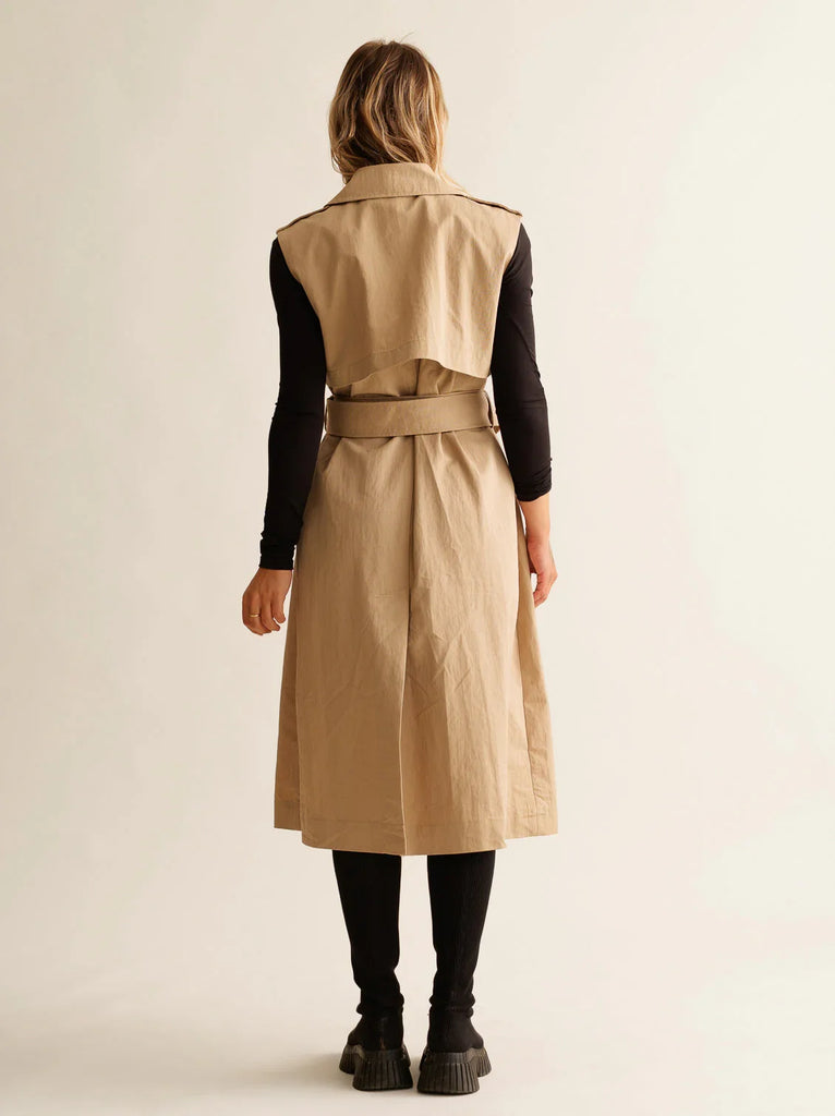 Audra Gabardine Dress — Beige trench dress on model, back view — MYFASHIONFRUIT