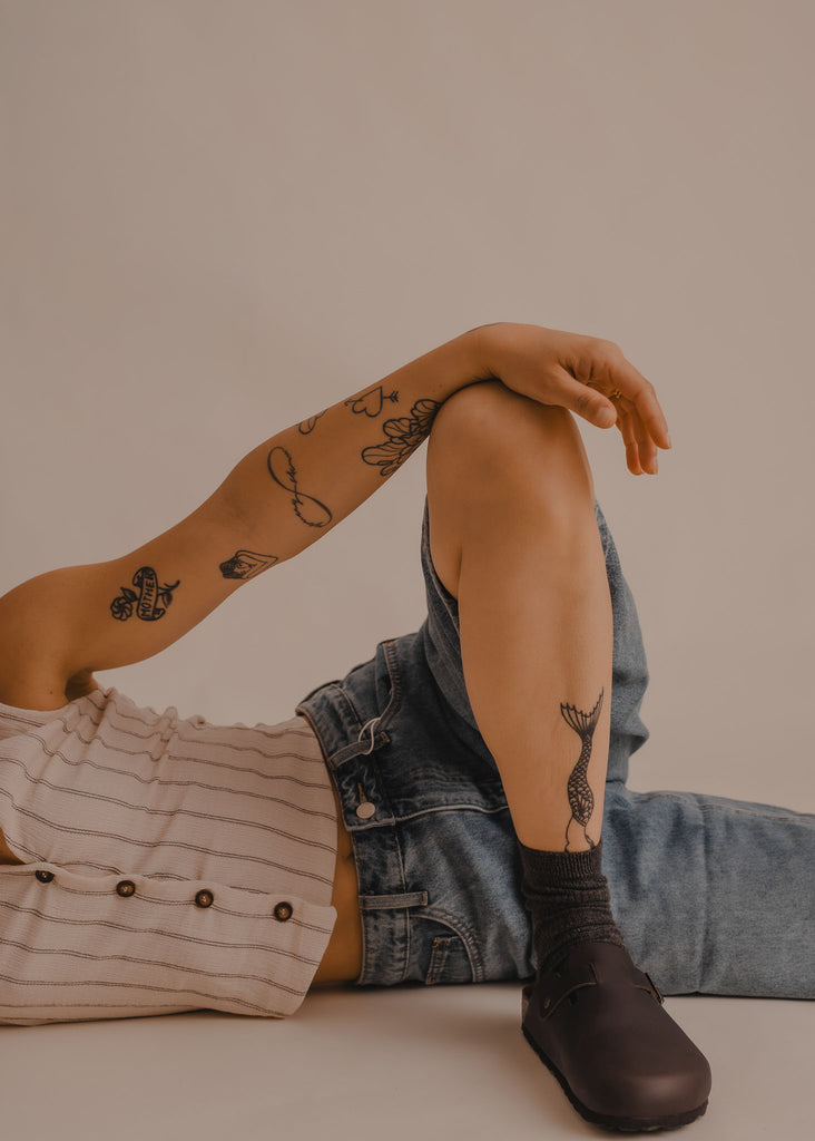 Bilbao Leather Clogs — Brown clogs, denim jeans, tattoos on model — MYFASHIONFRUIT