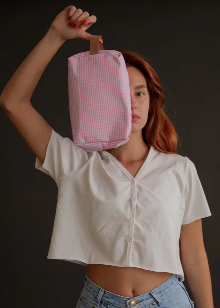Bailey Necessaire — Pink gingham bag with handle on model — MYFASHIONFRUIT