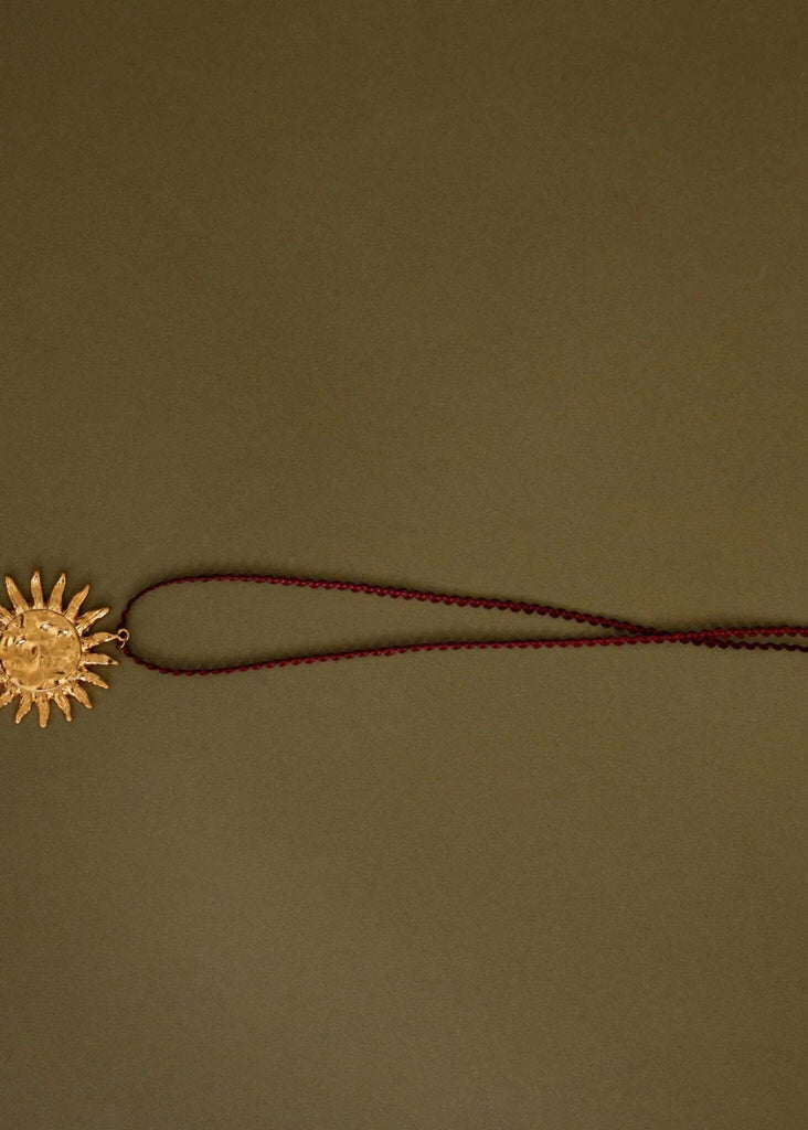 Anatoly Pendant — Gold sun pendant on red cord — MYFASHIONFRUIT