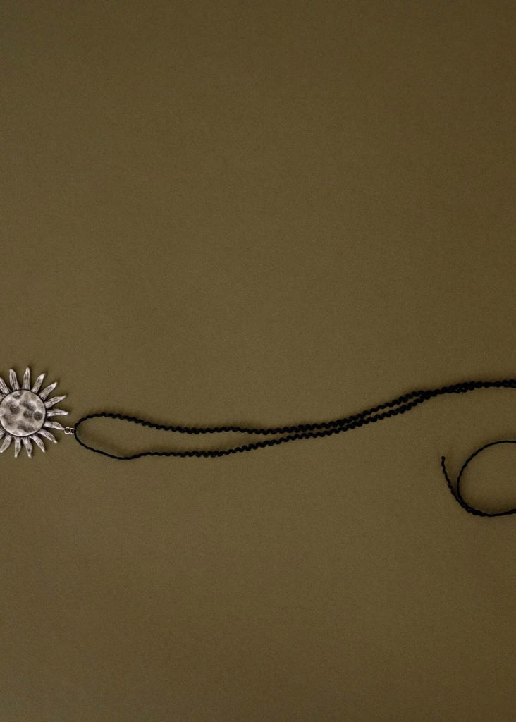 Anatoly Pendant — Silver sun pendant on black beaded cord — MYFASHIONFRUIT