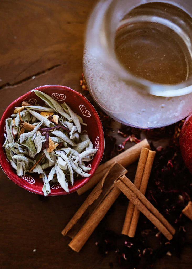 Yorti Herbal Blend — red bowl of herbal tea, cinnamon sticks — MYFASHIONFRUIT