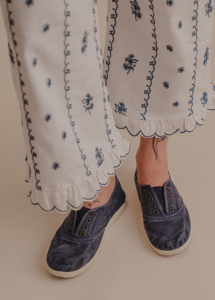 Old Arum Sneakers — Blue sneakers and white embroidered pants on model — MYFASHIONFRUIT