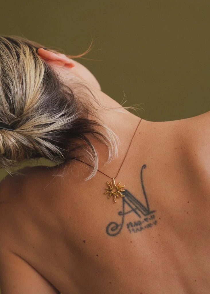 Sandya Pendant — Gold sun pendant on model — MYFASHIONFRUIT