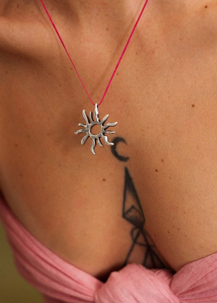 Sandya Pendant — Silver sun detail on pink cord on model — MYFASHIONFRUIT