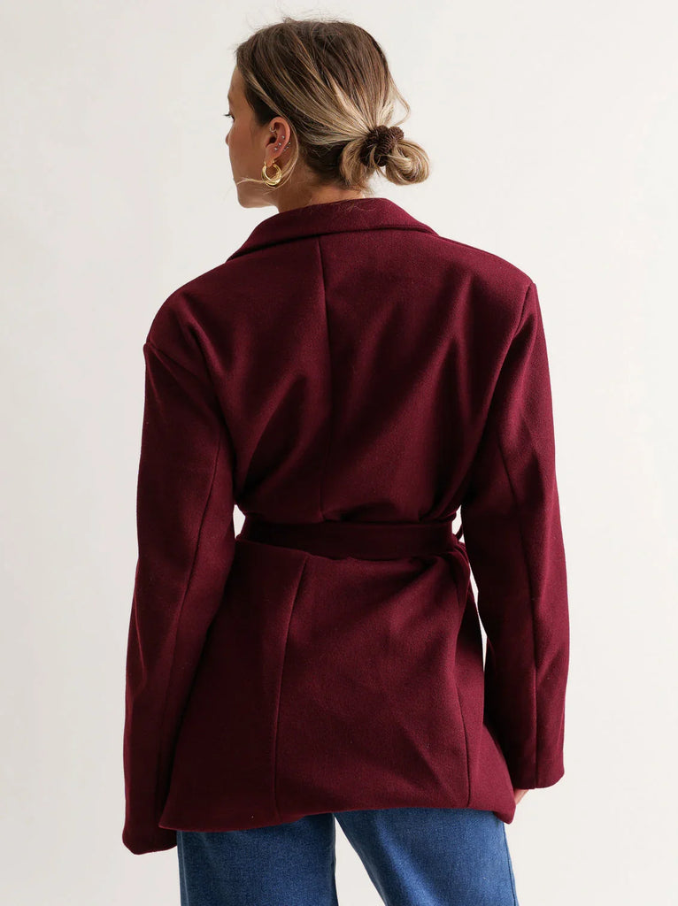 Lorenza Coat — Burgundy belted wool coat on model, back view — MYFASHIONFRUIT