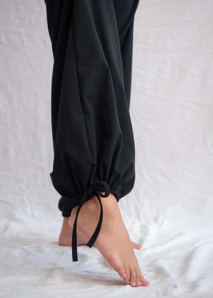 Yin Pants — Detail of black pants tied at ankle on model — MYFASHIONFRUIT