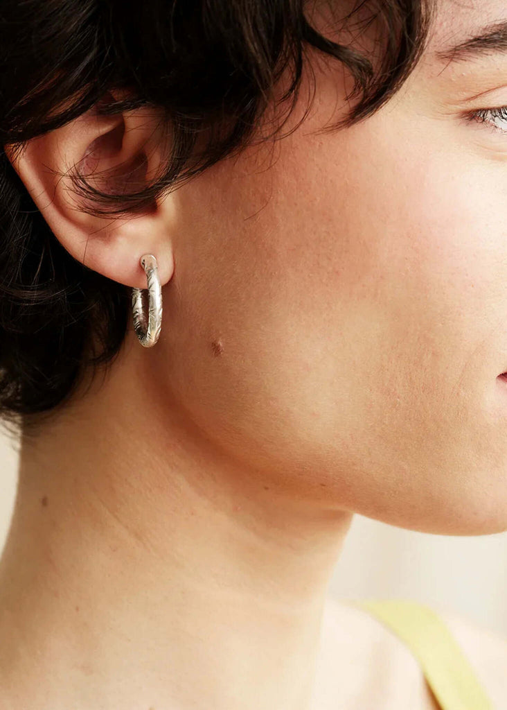 Flo Hoops — Silver textured hoops on model — MYFASHIONFRUIT