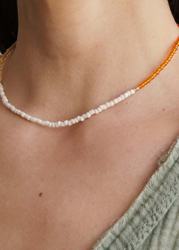 Gabby Necklace — White and orange beaded necklace on model — MYFASHIONFRUIT