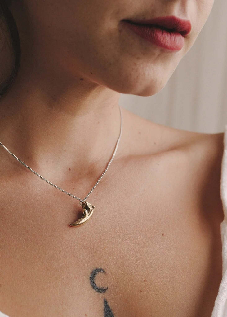 Savant Crab Claw Pendant — gold pendant detail on model — MYFASHIONFRUIT