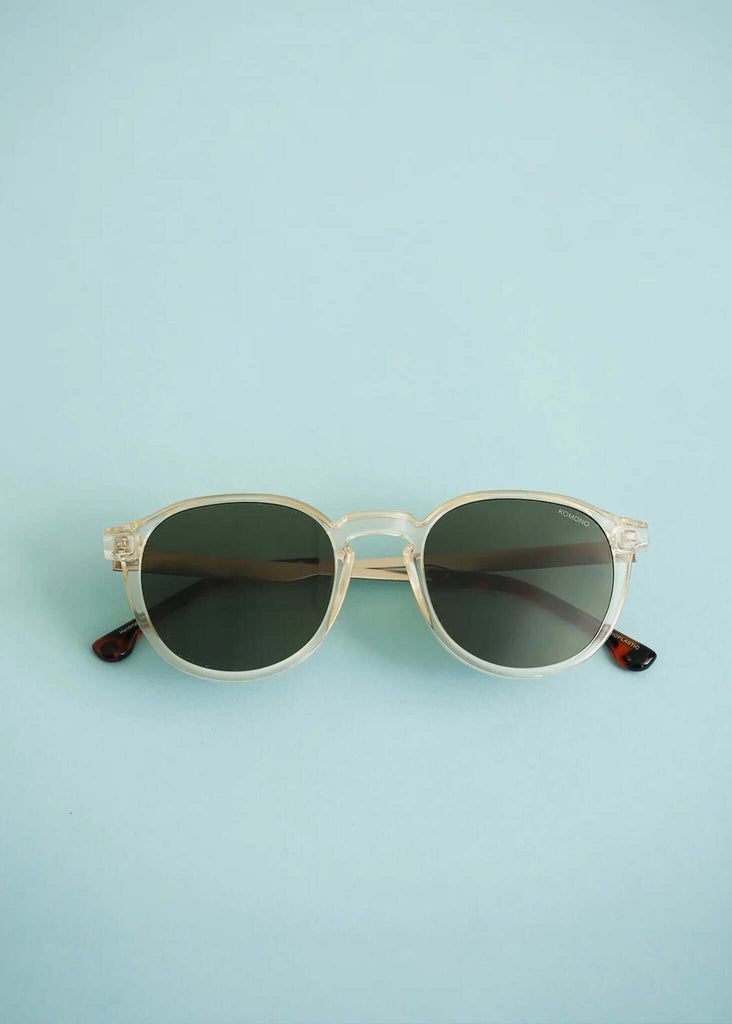 Komono LIAM Metal Prosecco Sunglasses — Round sunglasses on blue — MYFASHIONFRUIT