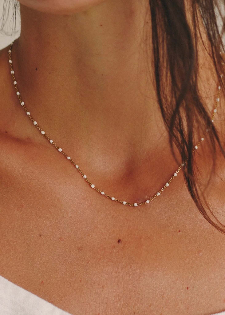 Dakota Necklace — gold chain with white beads on model — MYFASHIONFRUIT