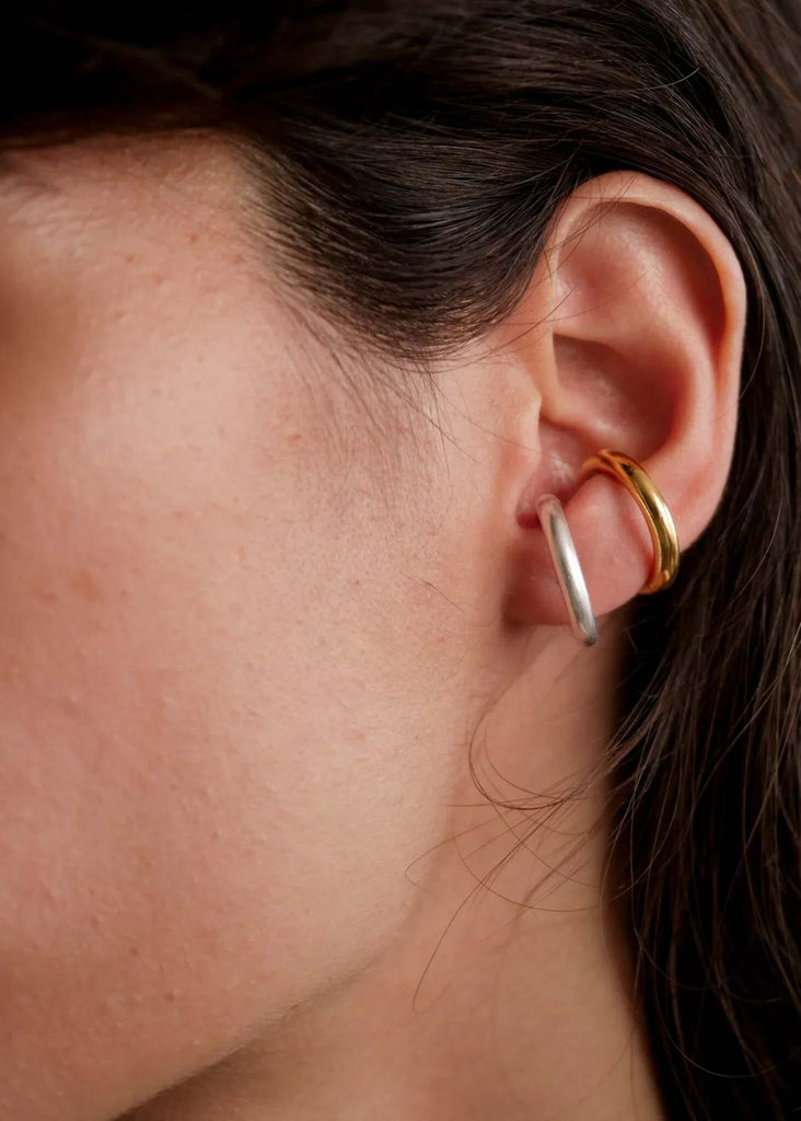 Delia Ear Cuffs — Gold and silver cuffs on ear, detail — MYFASHIONFRUIT