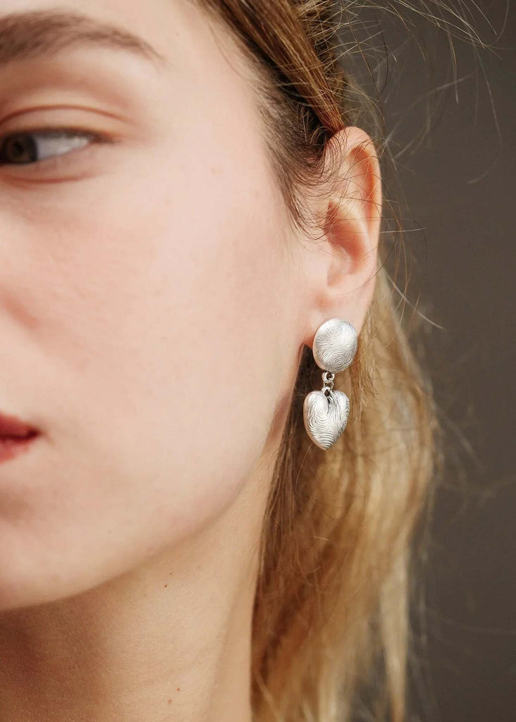 Esme Earrings — Silver heart earrings on model, detail — MYFASHIONFRUIT