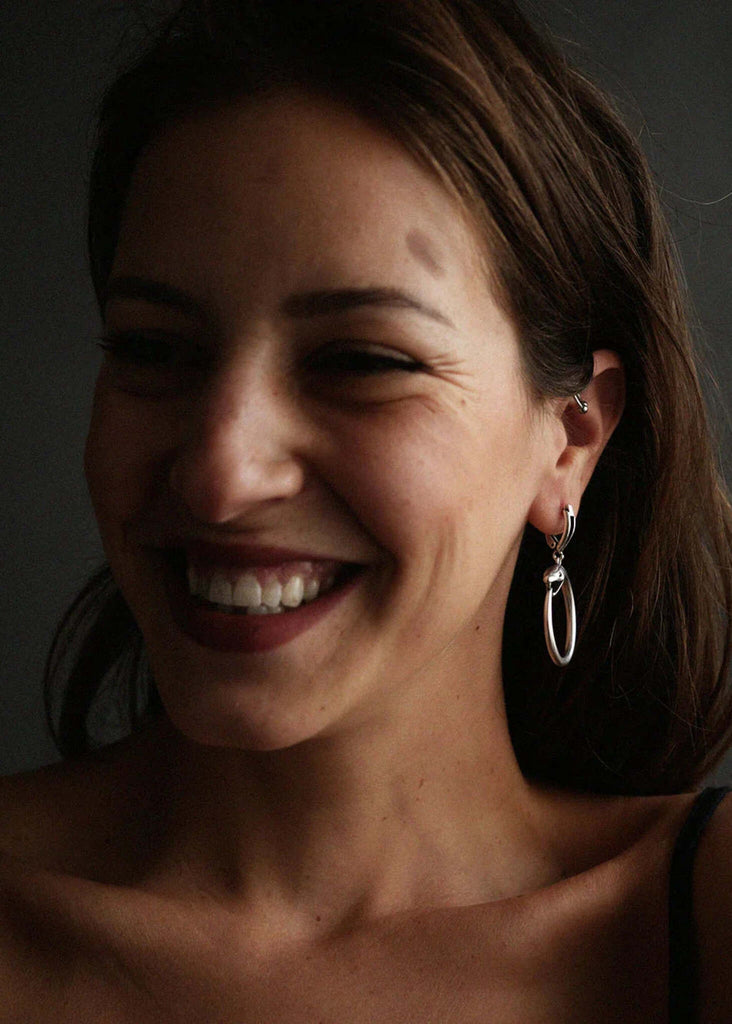 Medusa Hoops — Silver oval earrings on model — MYFASHIONFRUIT