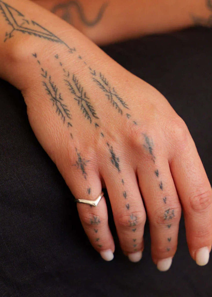 Venus Ring — Gold ring on hand with tattoos — MYFASHIONFRUIT