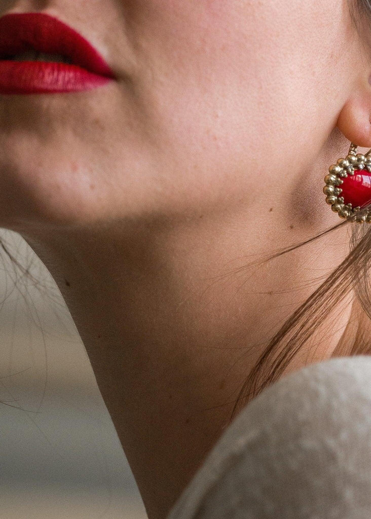 Frida Earrings — Close up on model, red heart earring — MYFASHIONFRUIT