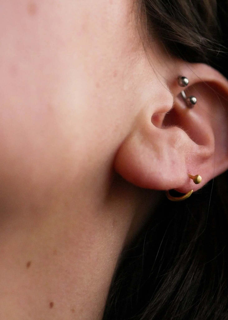 Petits Golden Hoops — gold earrings in ear, helix piercing detail — MYFASHIONFRUIT