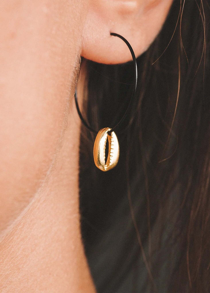 Sol Earrings — gold seashell pendant detail on black hoop earring — MYFASHIONFRUIT