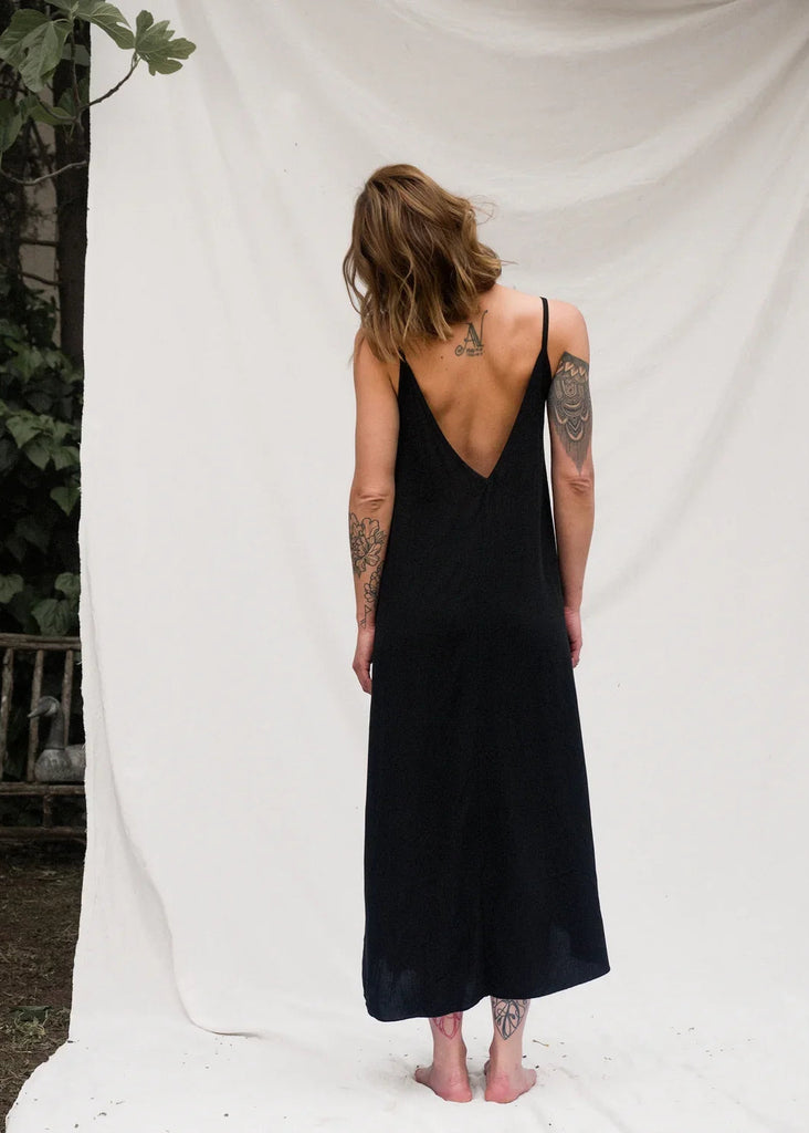Granadas Dress — Black maxi dress with low back on model — MYFASHIONFRUIT