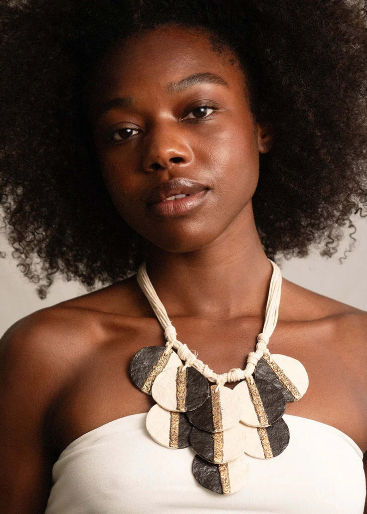 Woman wearing Ceres Necklace — black and off-white pendants with gold detail — MYFASHIONFRUIT