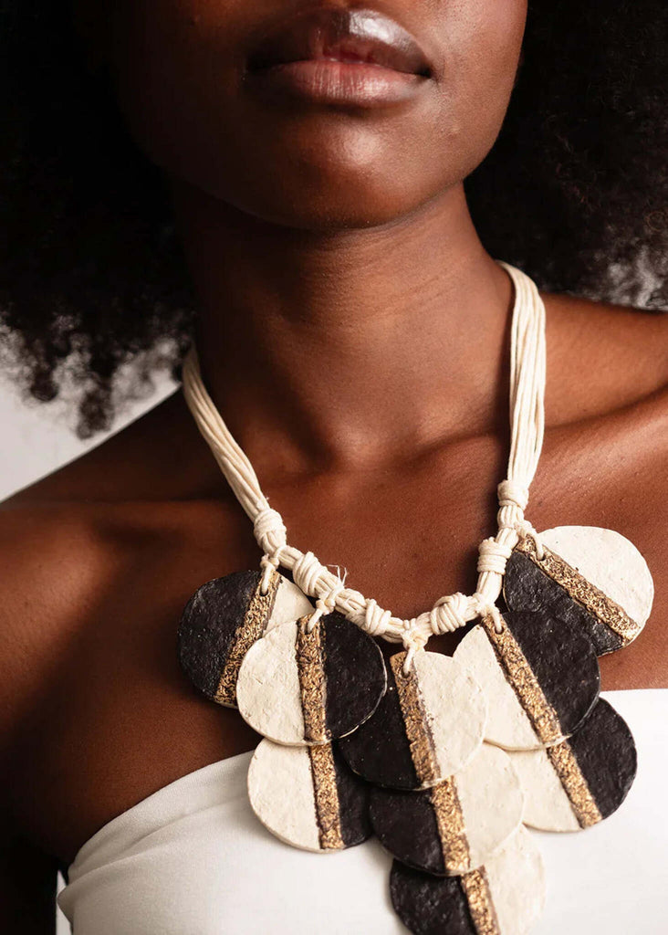 Woman wearing a Ceres Necklace, large paper mache circles with gold stripe detail — MYFASHIONFRUIT