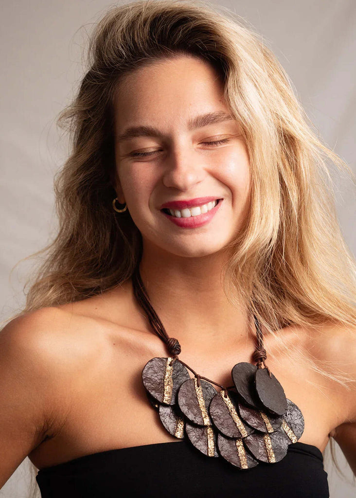 Woman wearing the Jove Necklace — brown and gold paper mache pendant necklace — MYFASHIONFRUIT