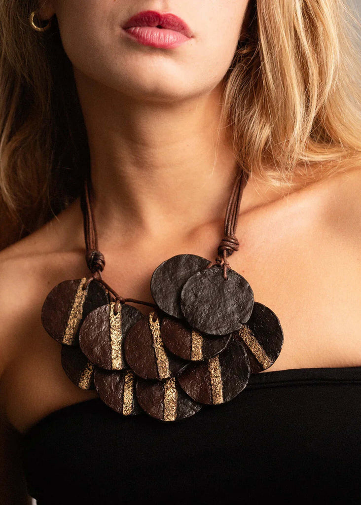 Woman wearing Jove Necklace — brown paper mache discs with gold detail — MYFASHIONFRUIT