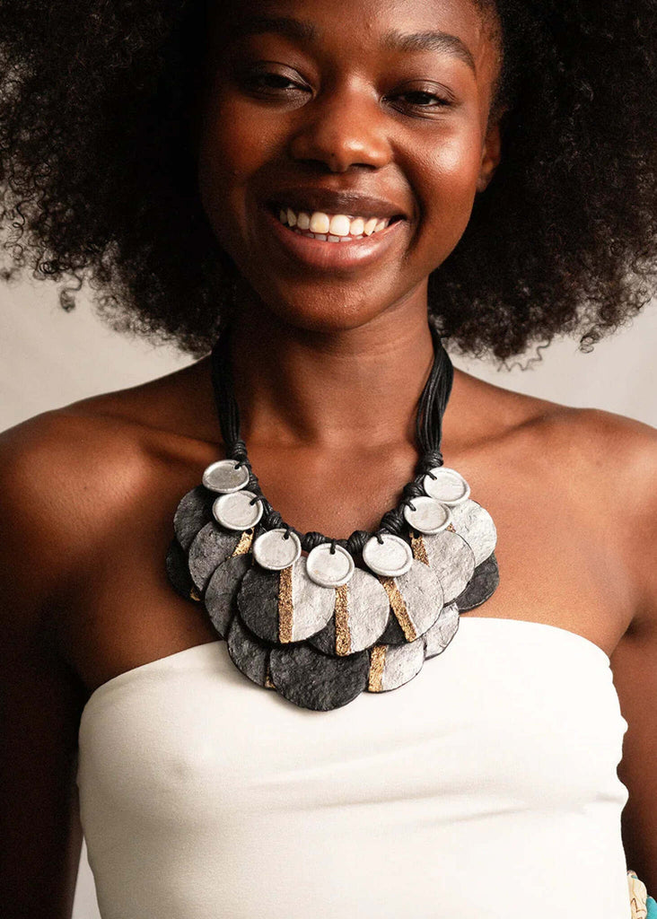 Woman wearing the Eris Necklace — black cord, paper mache pendants with silver and gold — MYFASHIONFRUIT