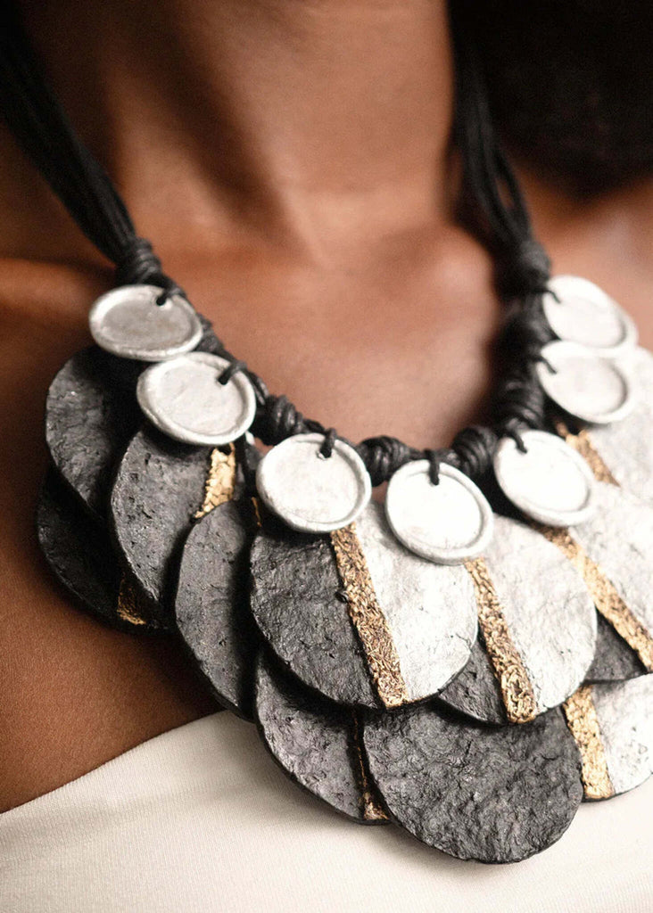 Woman wearing Eris Necklace — silver, black, and gold paper mache discs — MYFASHIONFRUIT