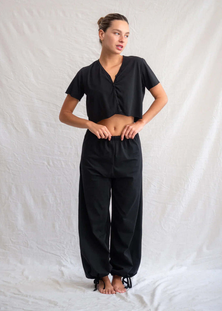 Woman wearing black Yin Pants and cropped top with button detail — MYFASHIONFRUIT