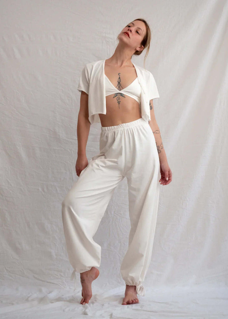 Woman wearing white Yang Pants and matching top — MYFASHIONFRUIT