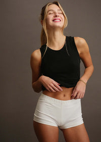 Woman wearing white Fierce Shorties and black tank top — MYFASHIONFRUIT