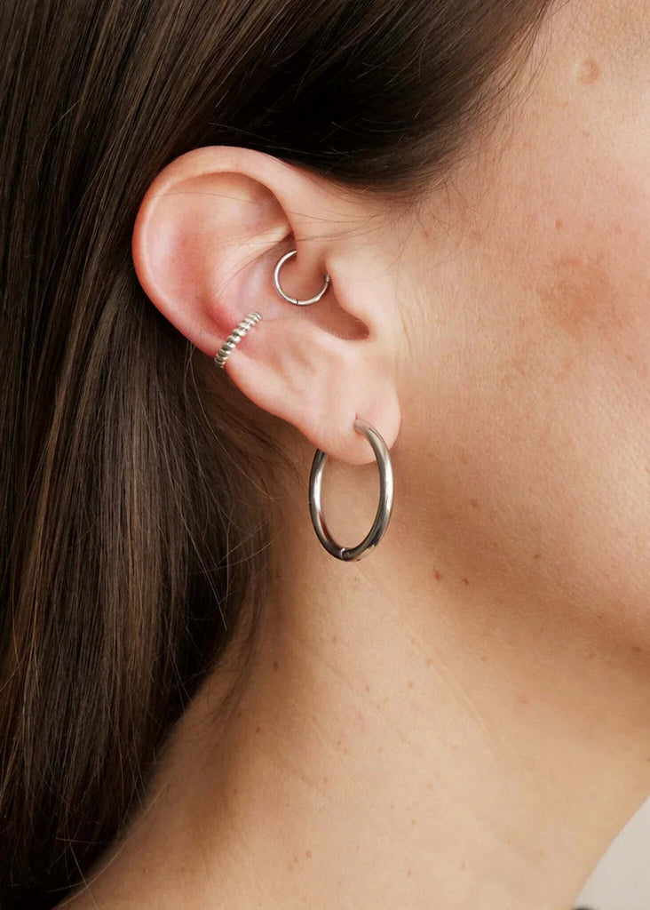 Bekke Ear Cuffs — Silver earrings on ear — MYFASHIONFRUIT